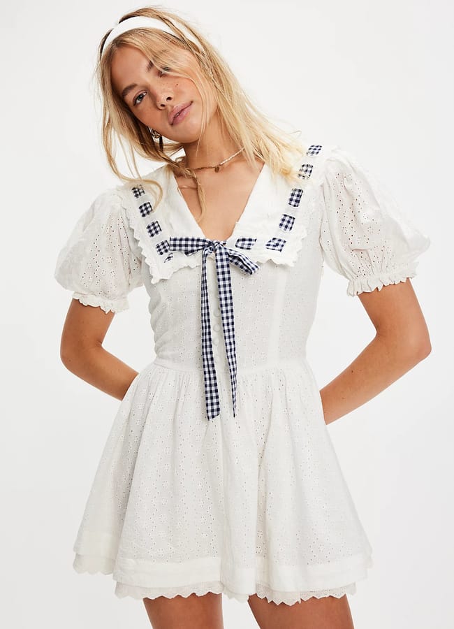 model wearing For Love & Lemons Ruby Ribbon Mini Dress