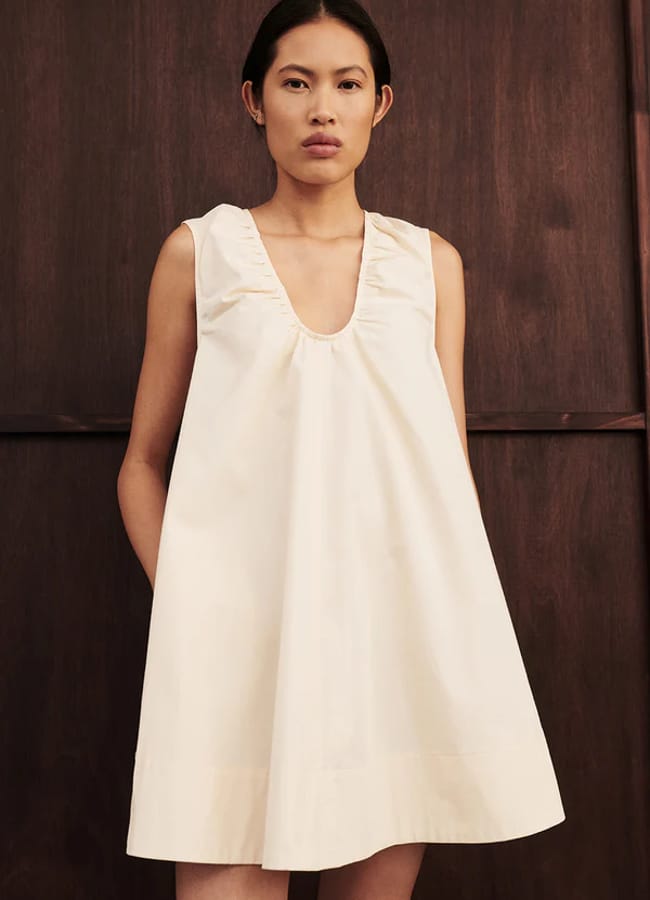 model wearing GABBY BUTTERMILK COTTON MINI DRESS