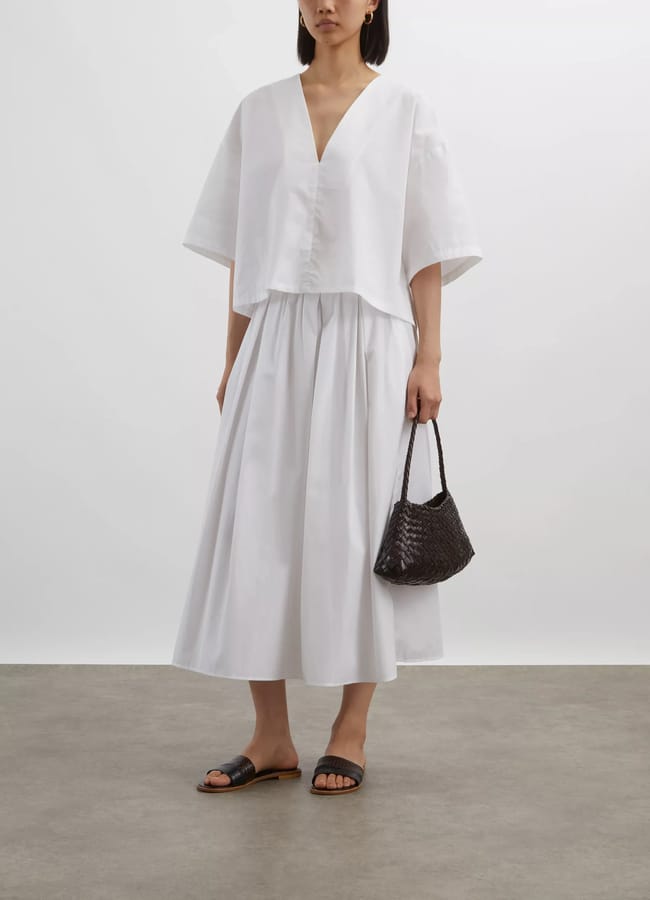 model wearing white Juliana Blouse and skirt