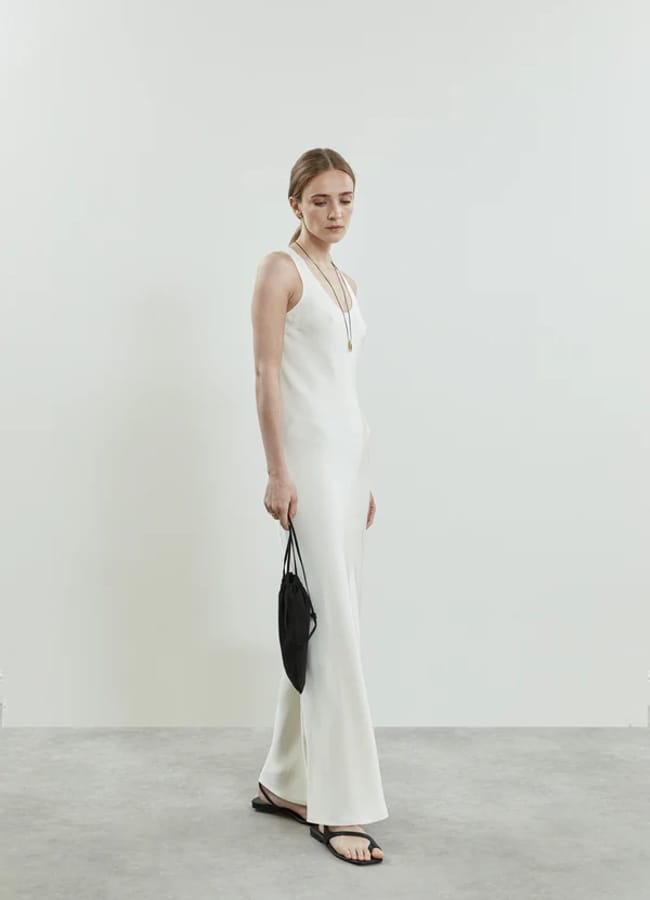 model wearing white dress
