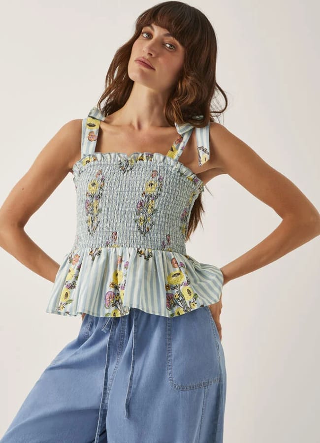model wearing Lucille Floral Stripe Smocked Top Blue