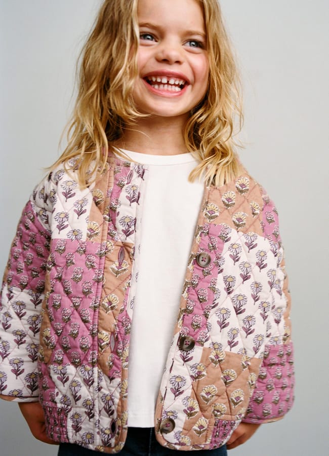 little girl wearing pink PATCHWORK BOMBER JACKET