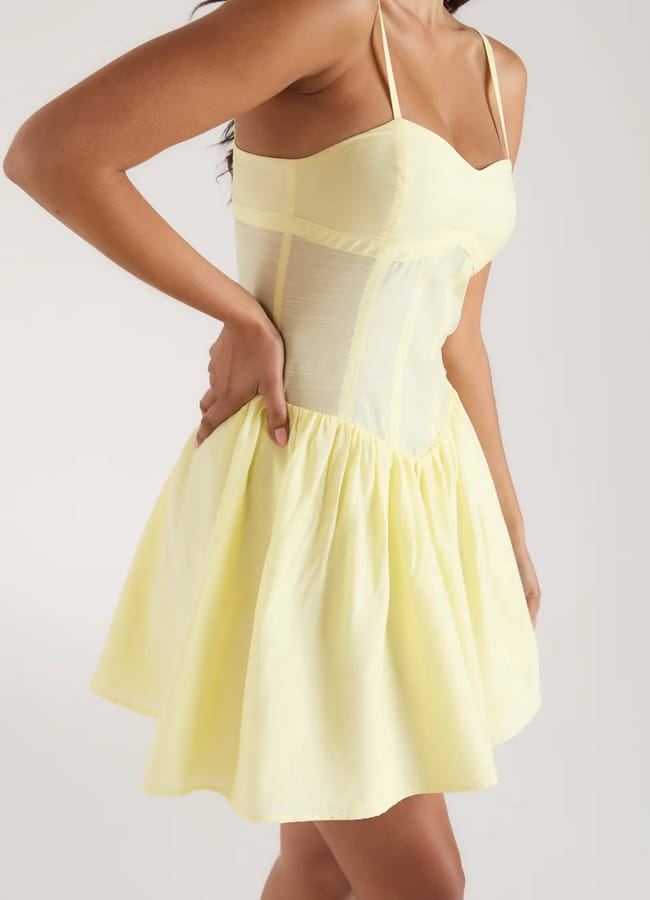 close up of model wearing yellow Seam Detail Mini Dress