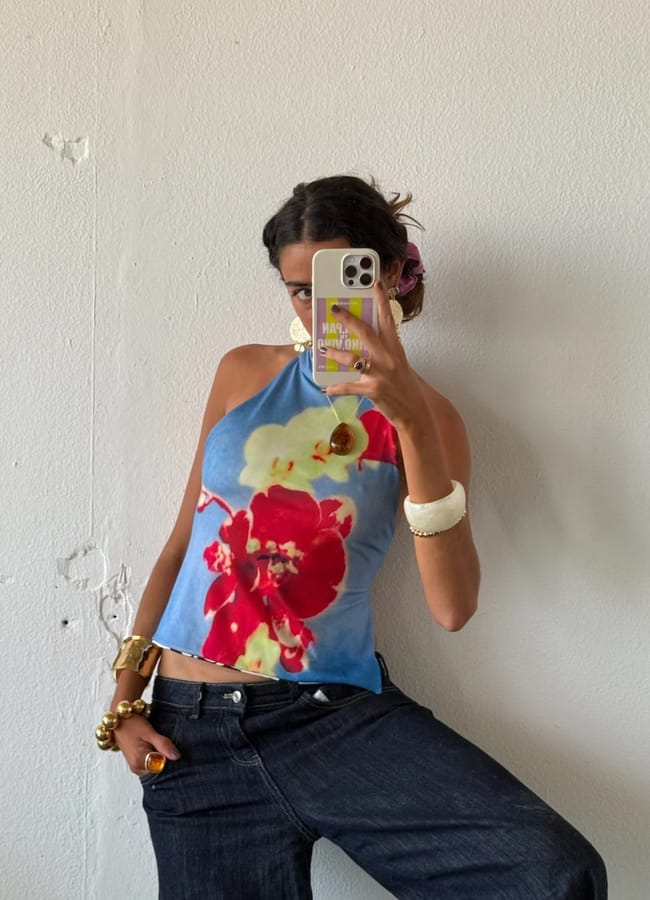 MODEL WEARING FLORAL TOP