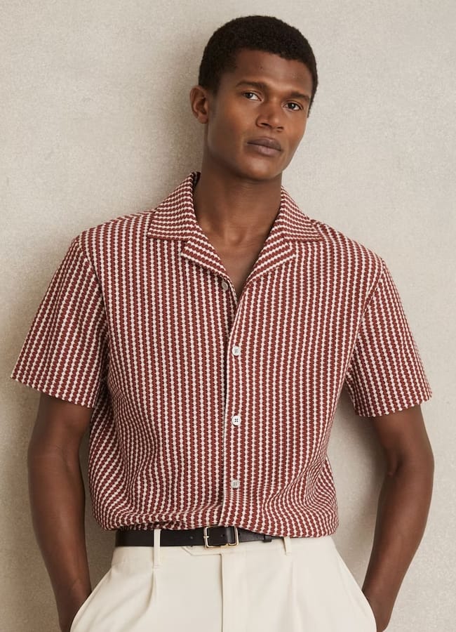 male model wearing Textured-Stripe Cuban-Collar Shirt in Rust Red:White