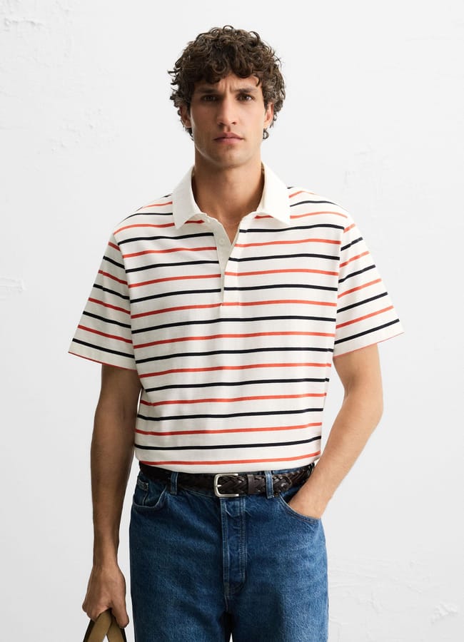 male model wearing Zara STRIPED POLO SHIRT and jeans