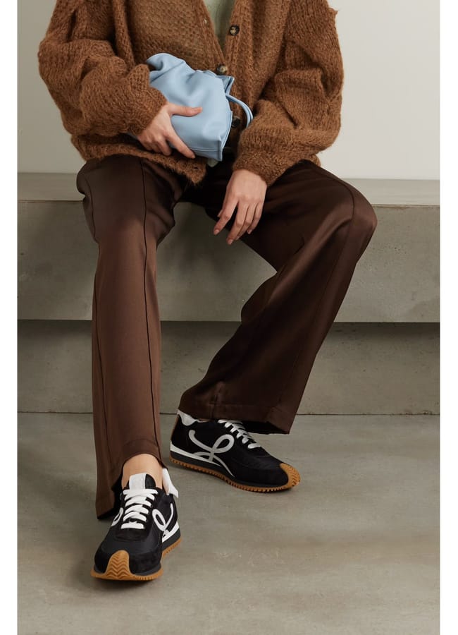 model's legs wearing LOEWE Flow logo-appliquéd leather and shell sneakers