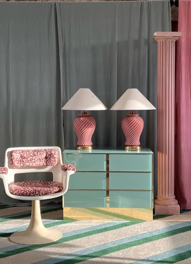 blue drawers with pink lights on top and pin k chair