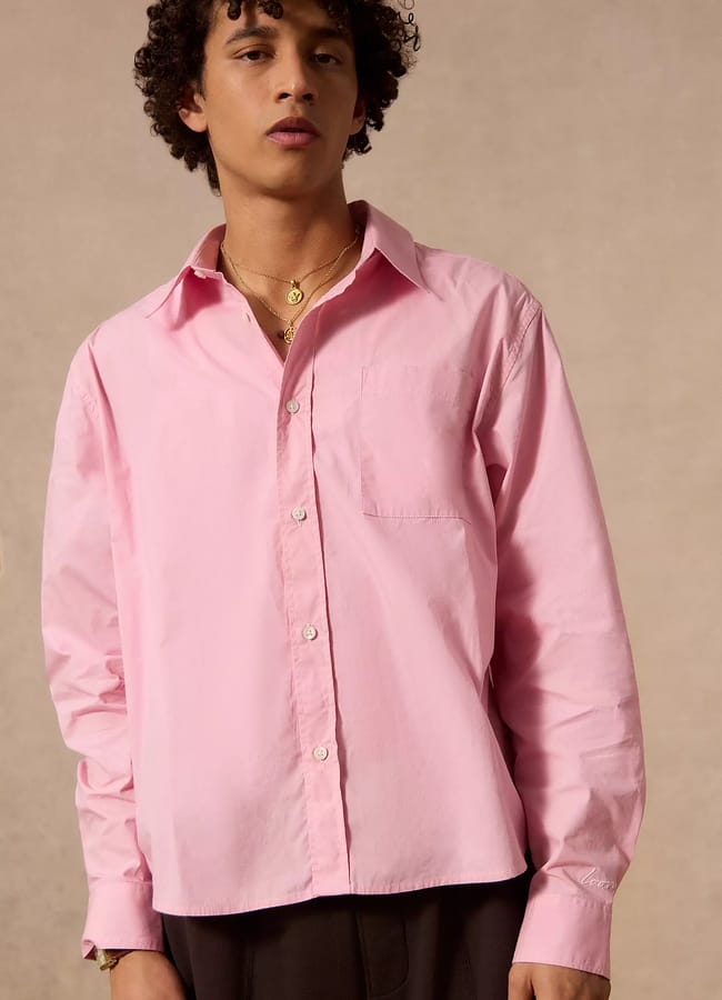 male model wearing UO Loom Nolan Pink Poplin Business Shirt