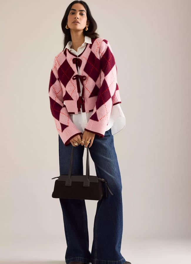 model wearing pink and red anthro Maeve Argyle Tie-Front Cardigan