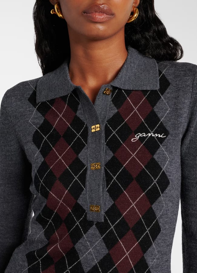 close up of model wearing grey Ganni Ganni Argyle wool polo sweater