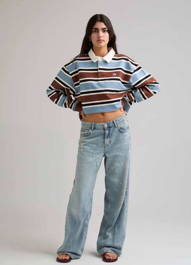 model wearing jeans and Loe Striped Rugby | Blue Brown