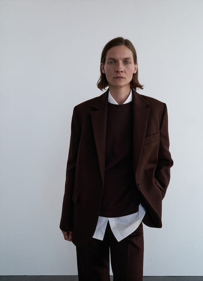 model wearing brown Mango 100% wool suit jacket