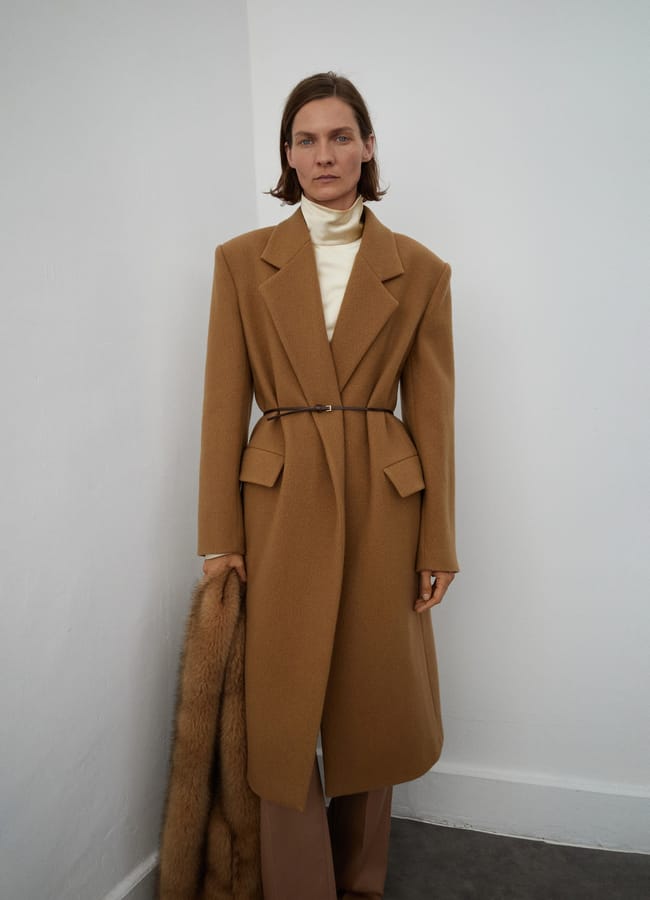 model wearing belted Mango Lapels wool coat