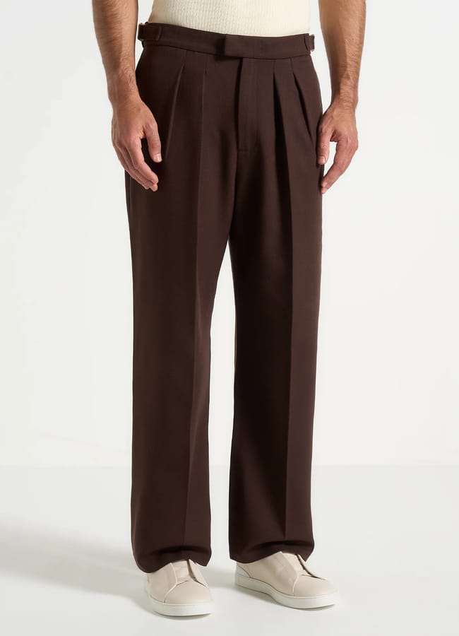 close up of male model wearing brown trousers