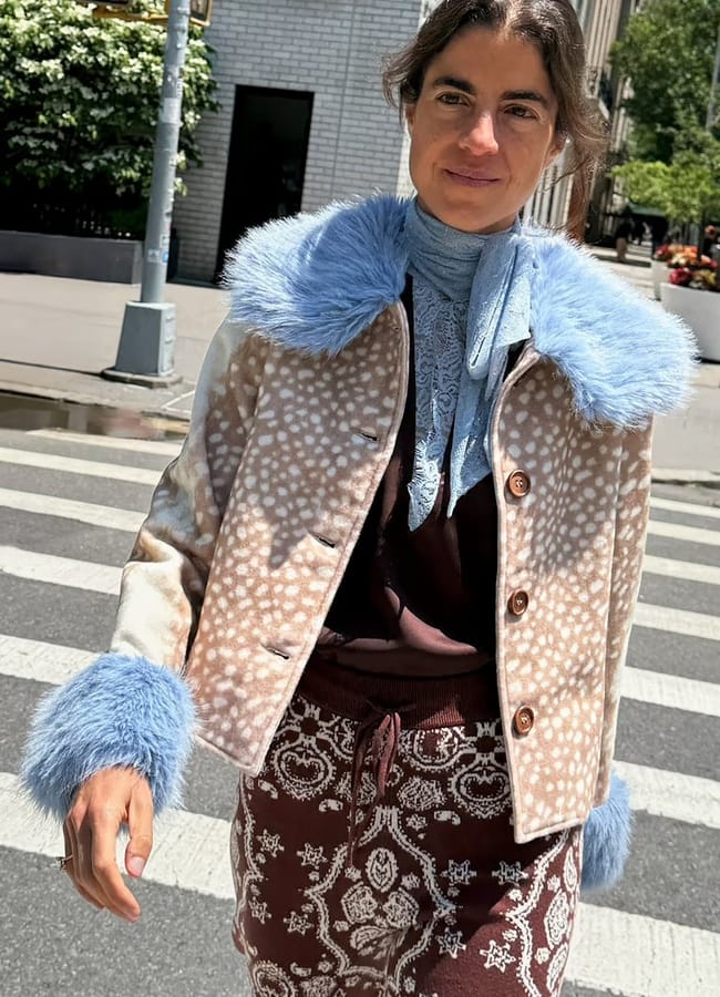 leandra medine wearing NFD Deer Print Jacket with Blue Faux Fur Trims
