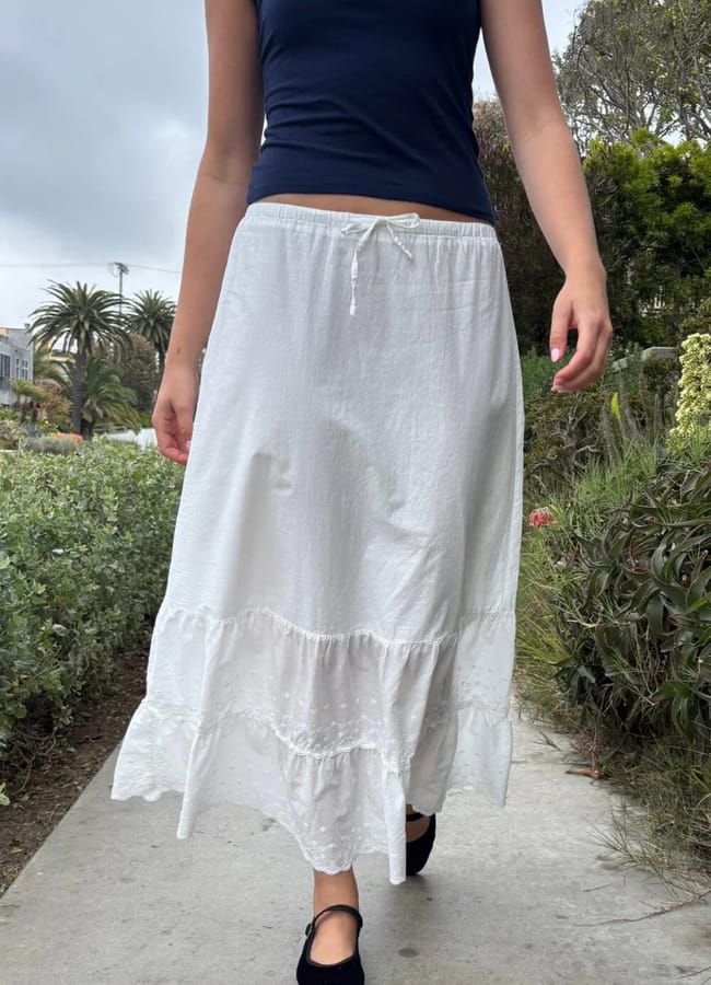 girl close up wearing white maxi skirt