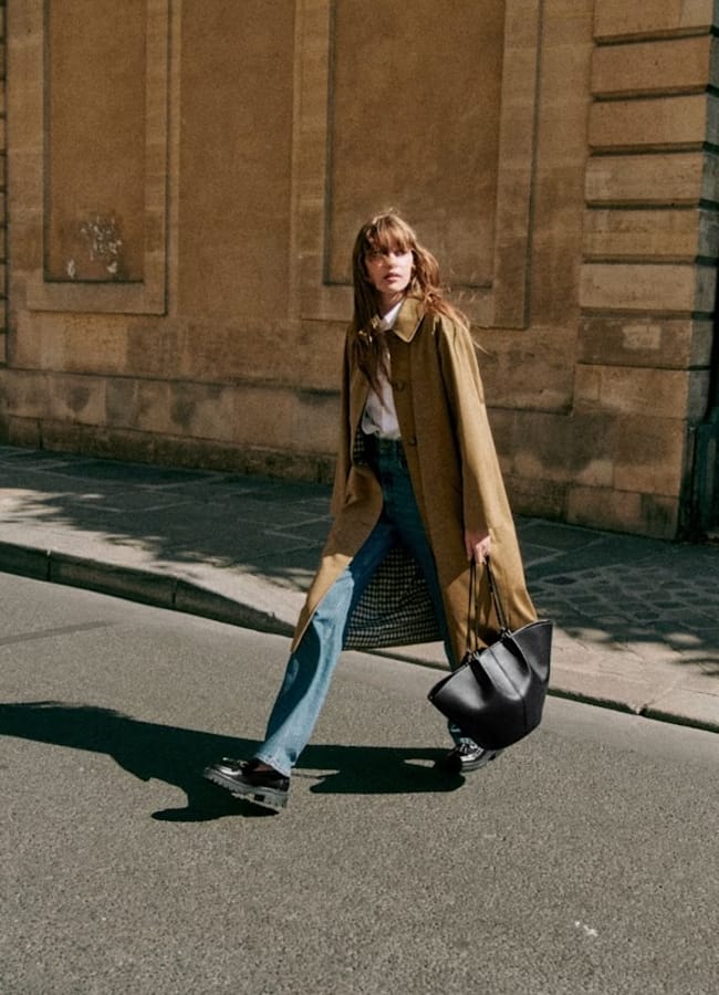 model wearing trench car coat in street