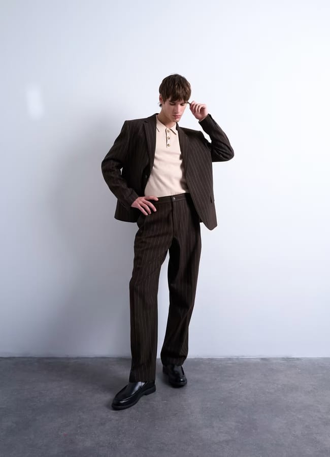 male model wearing brown pinstripe suit