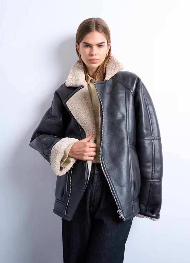 model weearing Topshop vintage wash shearling aviator bomber in black copy
