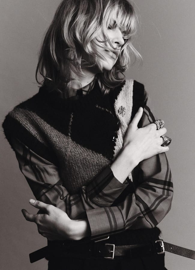 black and white image of female model wearing argyle top