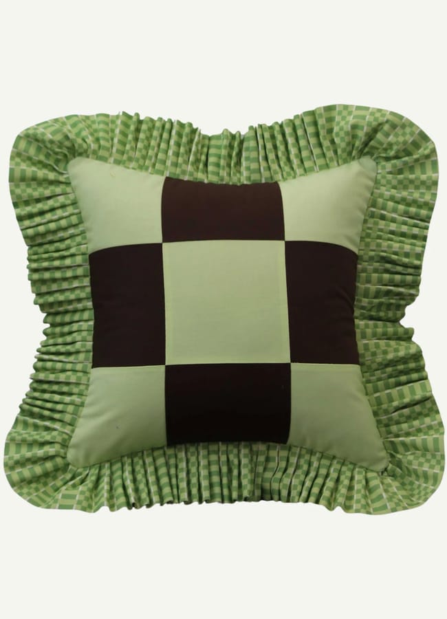 green checkerboard frilled cushion