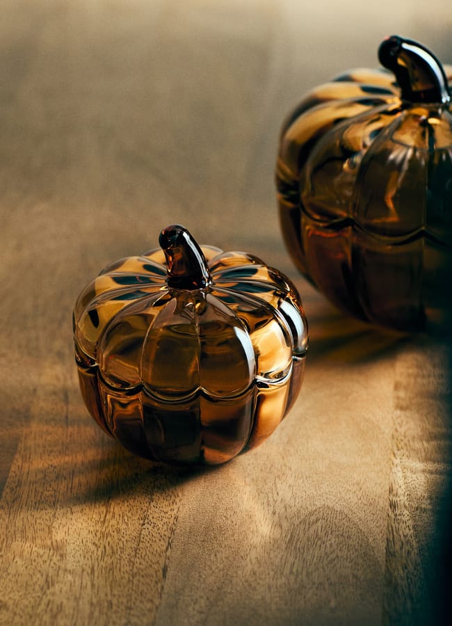 Small pumpkin-shaped glass jar