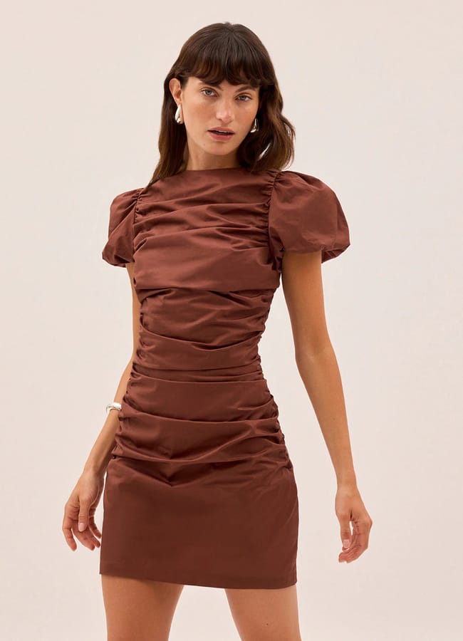 model wearing brown puffed sleeve ruched dress