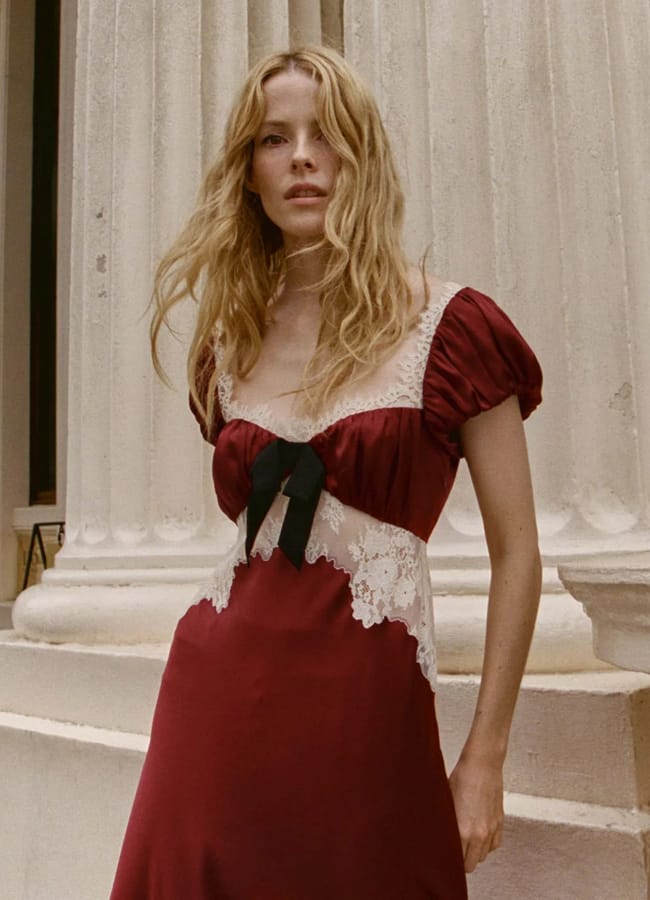 model wearing red velvet and white lace dress