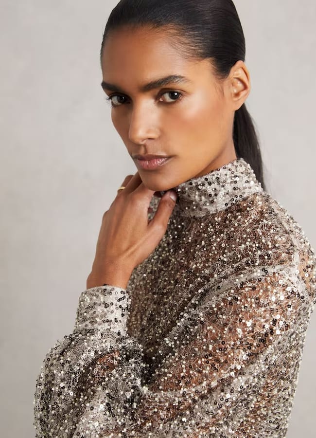 model wearing Reiss Sienna High-Neck Embellished Top in Silver