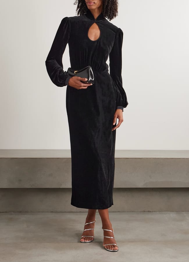 model wearing black SALONI Domino cutout velvet turtleneck midi dress