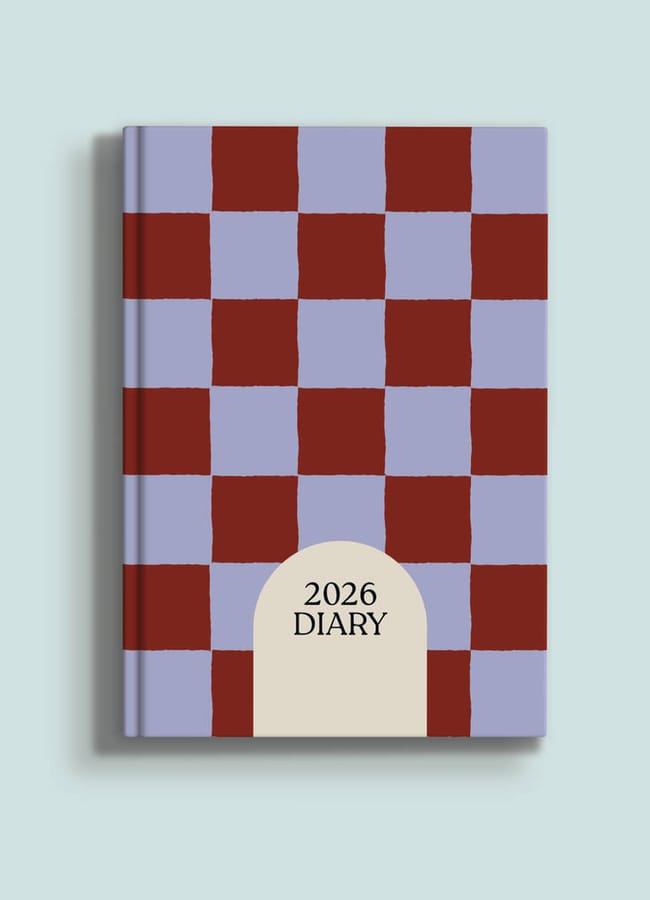 A 2026 diary from our 2026 diaries collection, featuring a red and lavender chequerboard cover with a beige arch displaying “2026 DIARY,” set against a pale blue background.