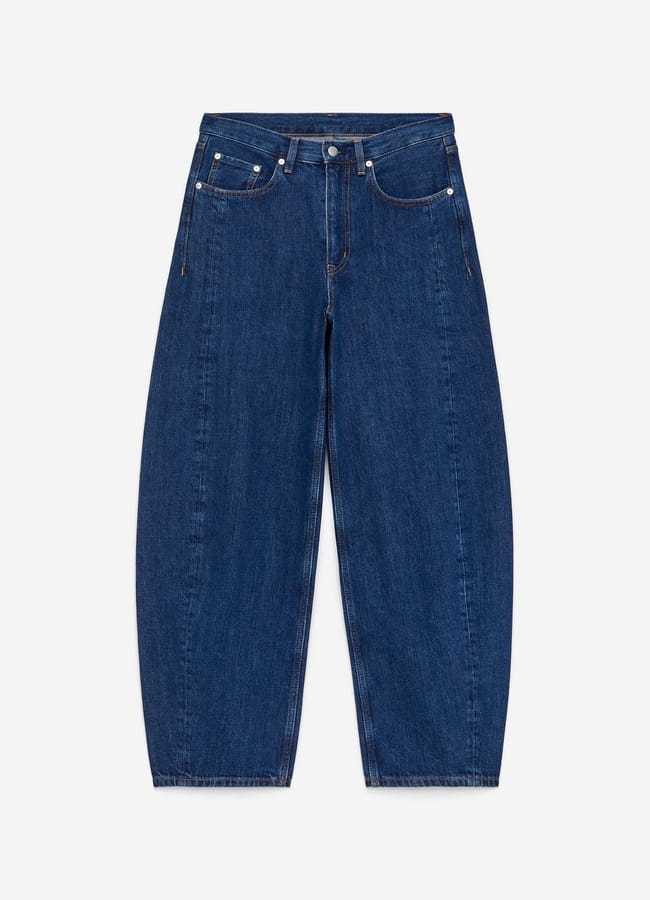 A pair of wide-leg, high-waisted blue jeans with five pockets, a button and zip fastening, and visible stitching, laid flat on a white background—perfect for styling your look after setting up a festive Christmas tablescape.