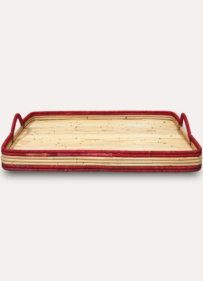 A rectangular bamboo tray with raised edges and two side handles, featuring red accents inspired by the Unexpected Red Theory, perfect for adding a bold 2026 interior design touch against a plain light background.