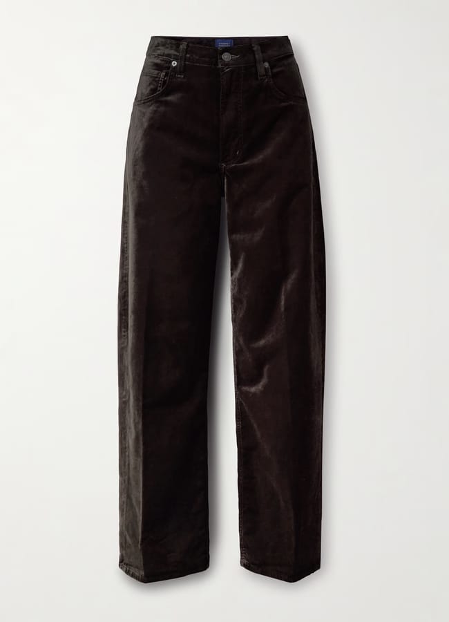 A pair of high-waisted, wide-leg black corduroy trousers with front and back pockets, offering the luxe look of velvet party wear, displayed against a plain white background.