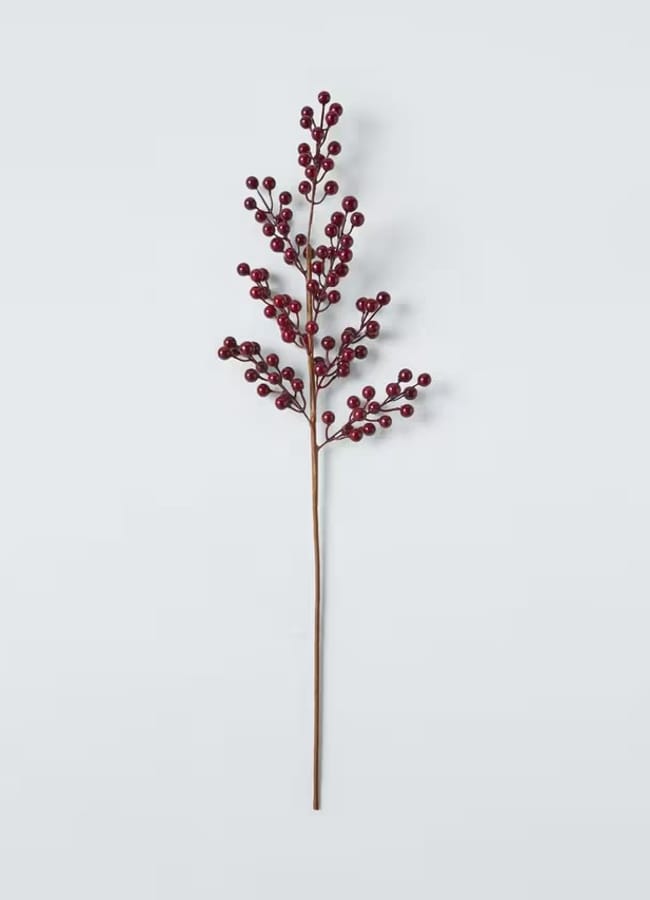 A single artificial branch with multiple clusters of small, round, red berries on thin, brown stems—perfect for a festive Christmas tablescape—arranged against a plain light grey background.