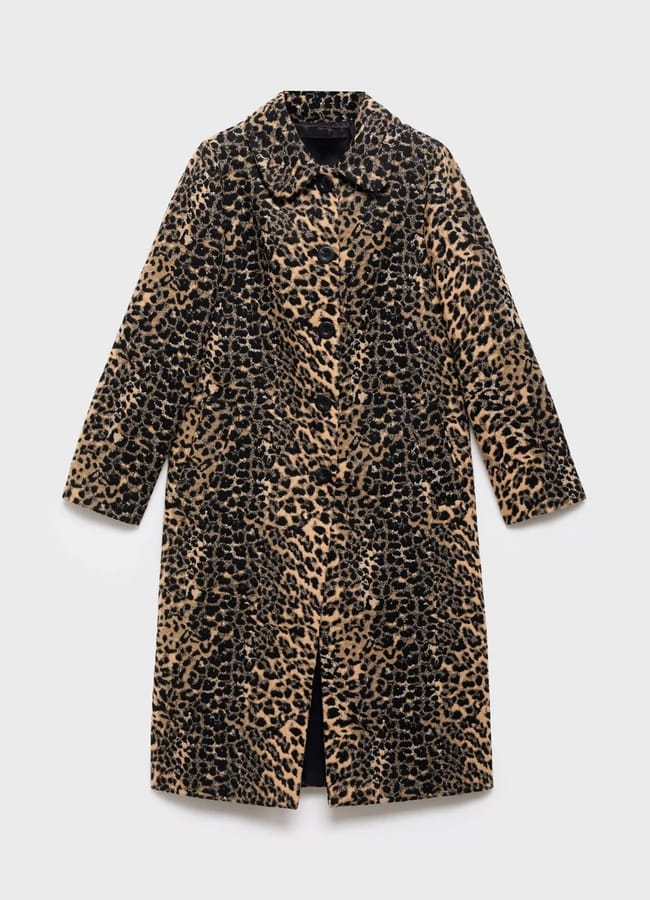 A long, tailored coat with a brown and black leopard print pattern, featuring a classic collar and long sleeves—perfect for layering over chic outfits with tights—displayed against a plain white background.
