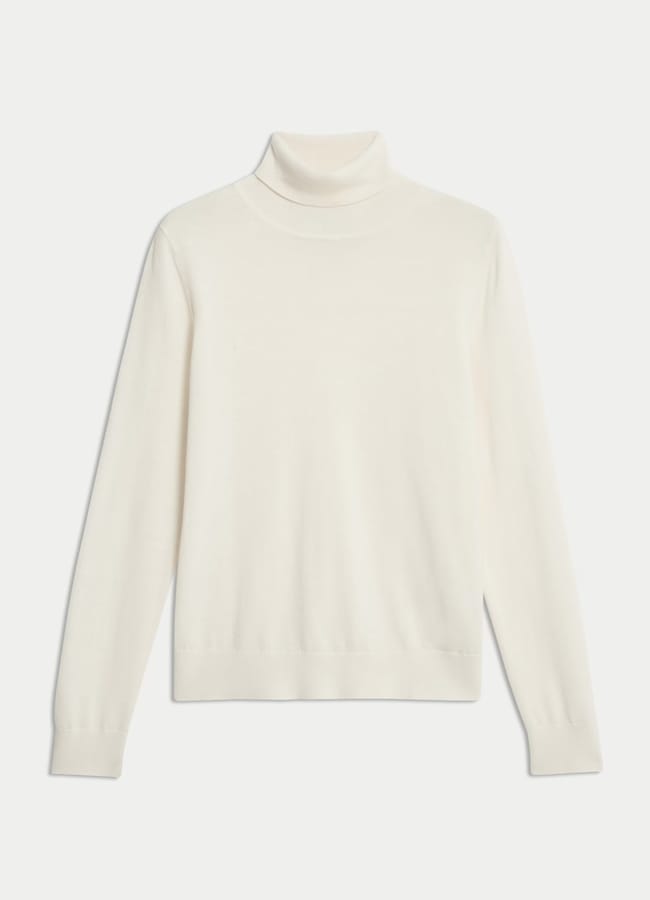A plain white polo-neck jumper with long sleeves, laid flat on a white background—perfect for pairing with brown trousers for a chic fashion statement.