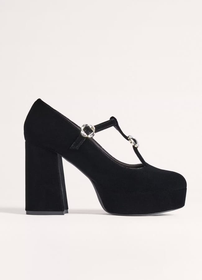 A black suede platform Mary Jane shoe designed for velvet party wear, featuring a thick high heel and two silver buckles on the T-bar, shown in side profile against a plain light background.