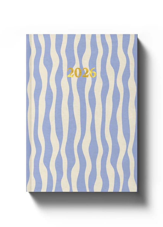 A hardback 2026 diary featuring wavy vertical blue and cream stripes, with 