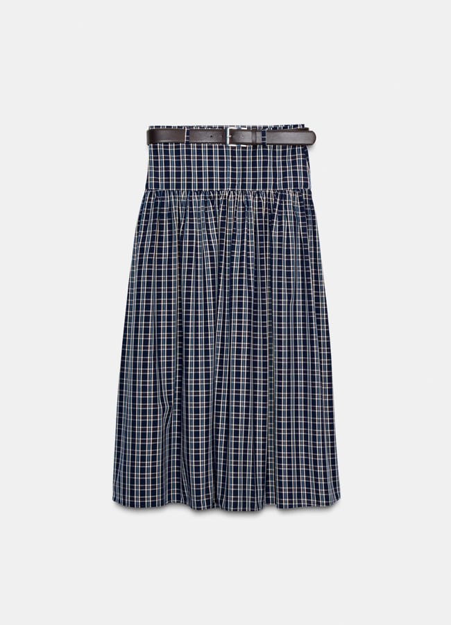 A navy blue and white checked pleated skirt with an elasticated waistband and a brown belt, perfect for styling beside your Christmas tablescape, displayed against a plain white background.