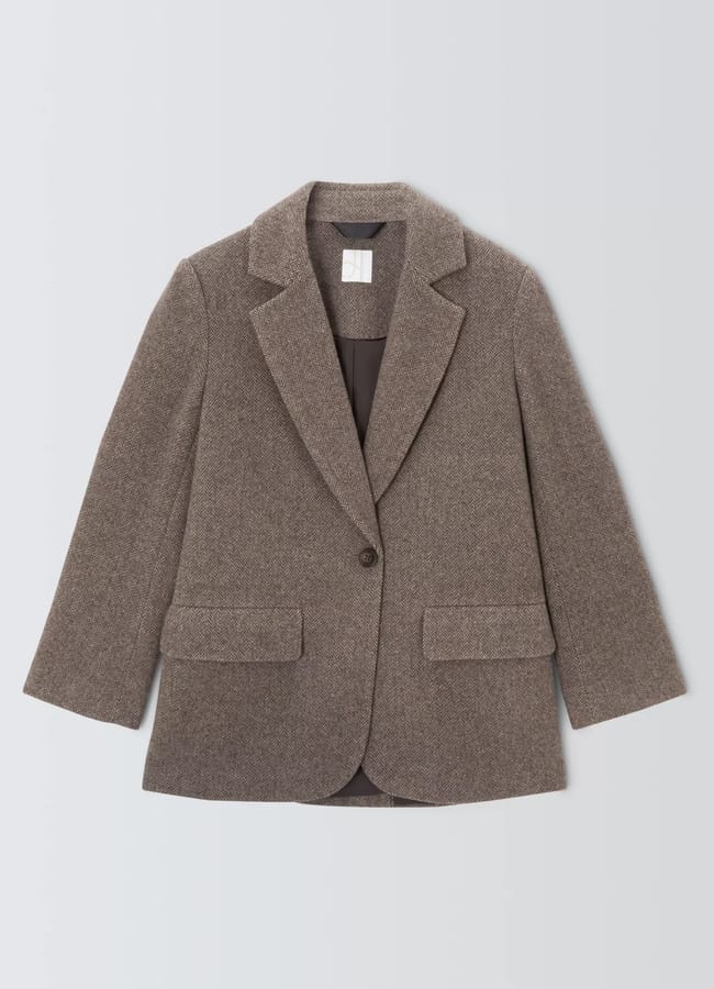 A brown tweed blazer with a notched lapel, single-button fastening, two front flap pockets, and long sleeves, laid flat on a light background—a true High Street Blazers pick for any Fashion Editor’s wardrobe.