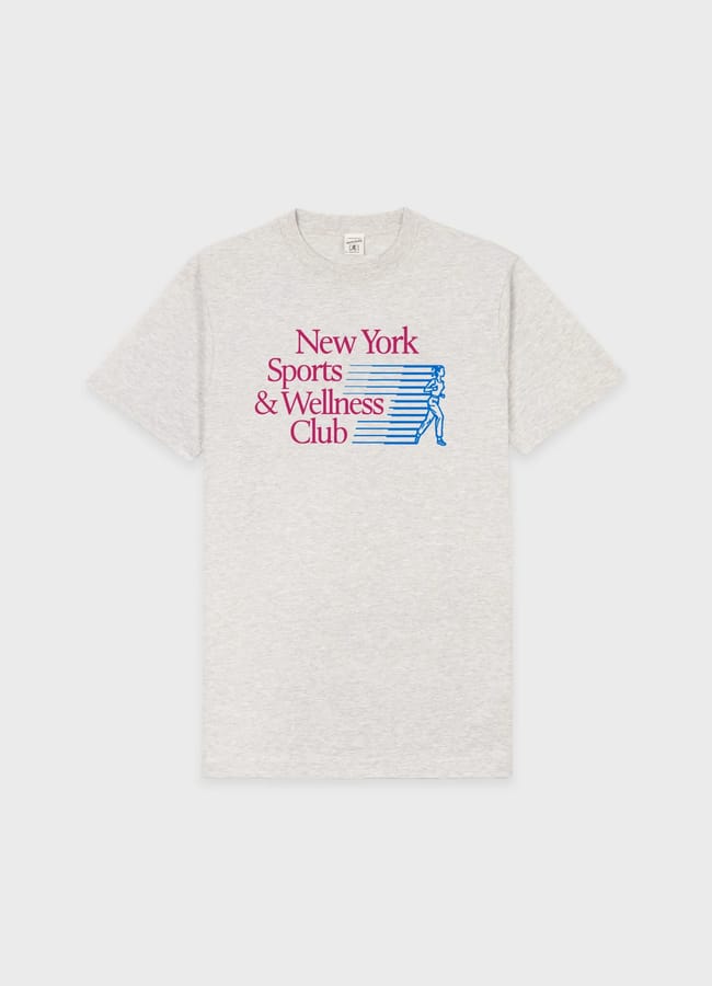 A light grey T-shirt, perfect as gym clothes for men, featuring the text New York Sports & Wellness Club in red and a blue graphic of a running person with horizontal lines, all on the upper front centre.