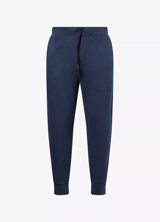 Navy blue jogger trousers with an elastic waistband, black drawstring, side pockets, and ribbed cuffs—perfect gym clothes for men—displayed on a plain white background.