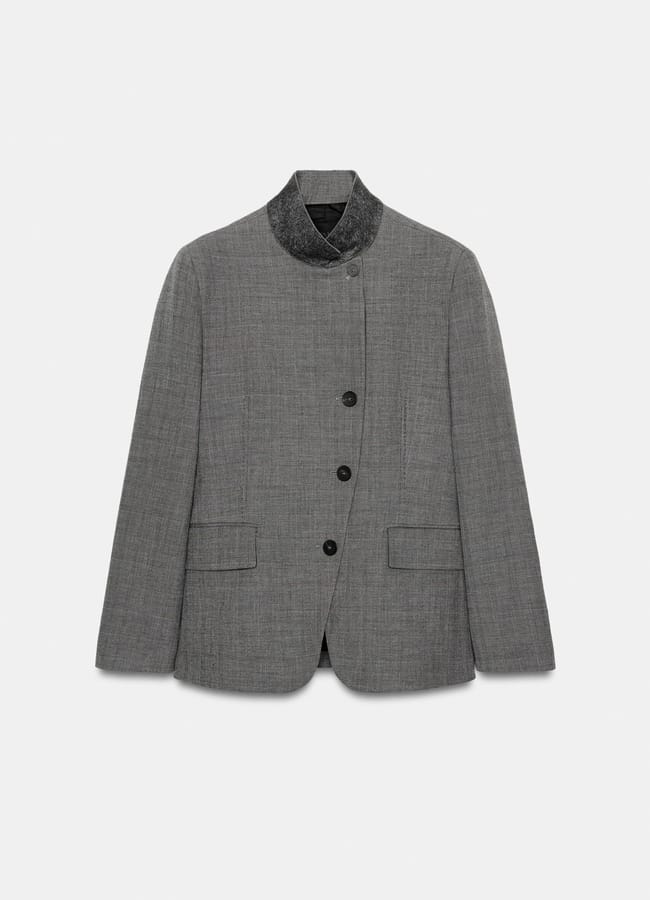 A grey tailored blazer from High Street Blazers, featuring a textured black velvet collar, three black buttons, and two front flap pockets—perfect for a polished, Fashion Editor-approved look on a plain white background.