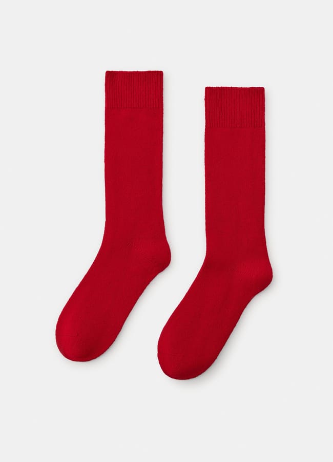 A pair of plain, bright red crew socks—perfect as bold red accessories—are laid flat side by side on a white background.
