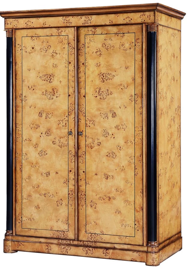 A tall wooden wardrobe with two closed doors, a light brown finish featuring a marbled pattern, and black vertical columns on each side.