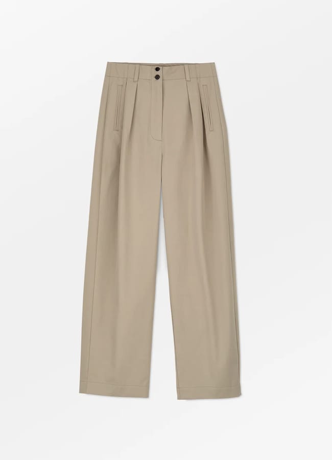 Beige pleated trousers with wide legs, front pleats, side pockets, and a double-button waistband, laid flat on a white background.
