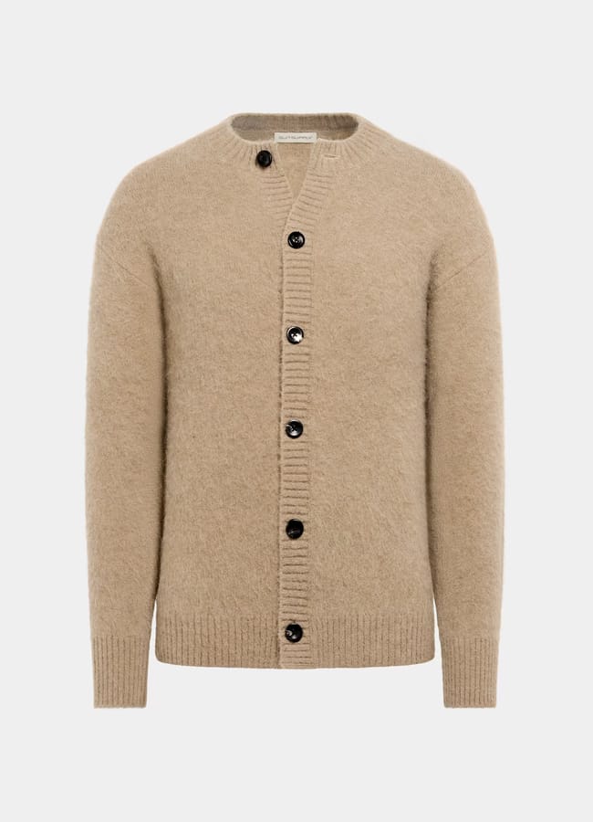 Beige long-sleeve wool cardigan with black buttons down the front, ribbed cuffs, hem, and neckline—perfect for casual date night looks—displayed on a plain white background.