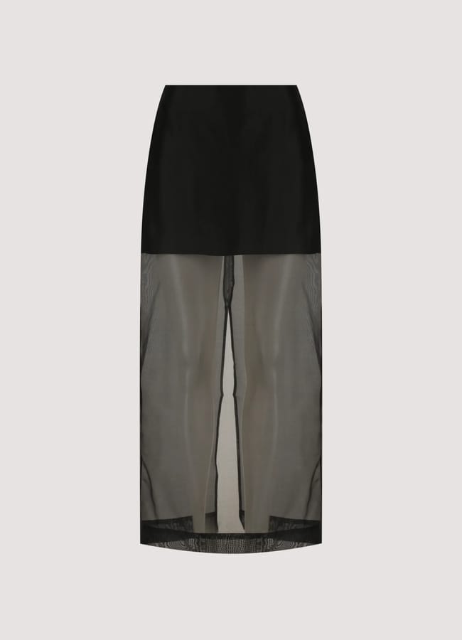 A black midi skirt with an opaque upper section and a sheer, see-through lower half, displayed against a plain light background.